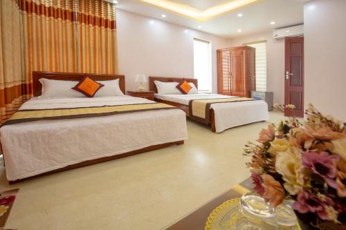 Giường trong phòng chung tại Biệt thự Sao Biển - SB118 FLC Sầm Sơn Resort
