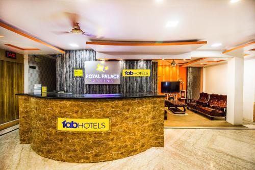 a lobby of a hotel with a reception desk at Royal Palace Marina in Chennai
