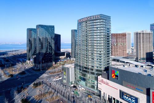 an aerial view of a city with tall buildings at Fraser Suites Dalian in Dalian