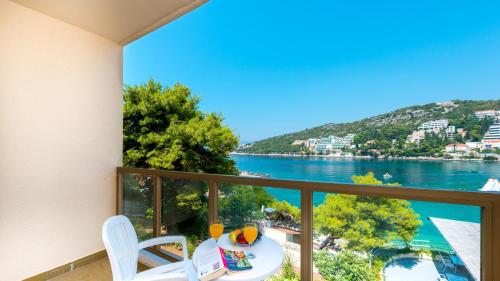 a balcony with a view of the water at Hotel Vis in Dubrovnik