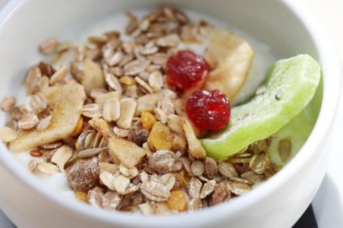 a bowl of granola and cranberries on a table at Mon Port Hotel & Spa in Port d’Andratx