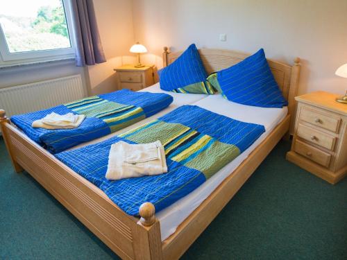 Łóżko lub łóżka w pokoju w obiekcie Am Maiglöckchenberg 19