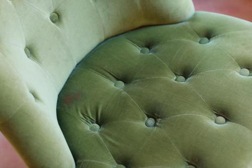 a close up of a green chair with buttons at Mon Port Hotel & Spa in Port d’Andratx