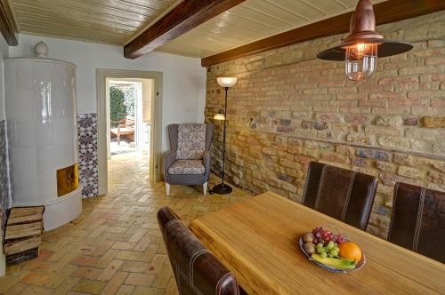 a living room with a table and a brick wall at Oluf 12 in Flensburg