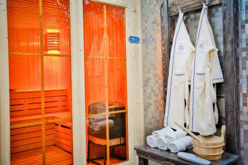 a sauna with a bunch of towels in a room at Hotel Orion Tbilisi in Tbilisi City