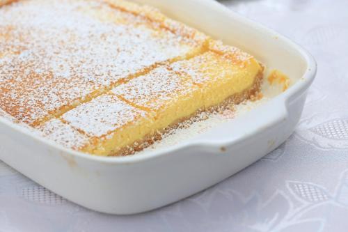 a cake in a white dish on a table at Casale Madeccia in Sonnino