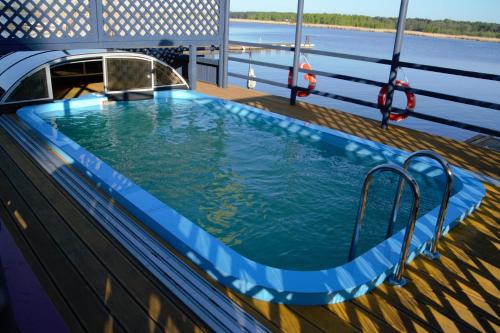 a swimming pool on the deck of a cruise ship at Porto Marine in Jūrmala