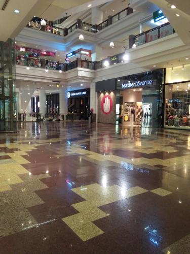 an empty mall with a shopping center with stores at Grand Service Apartment @ Times Square in Kuala Lumpur
