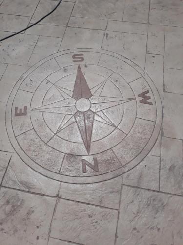a drawing of a pentagram on a tile floor at Papatsas Center Houses in Nydri