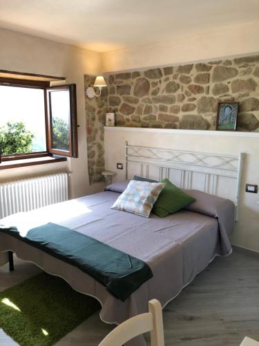 Postel nebo postele na pokoji v ubytování Iris Country House