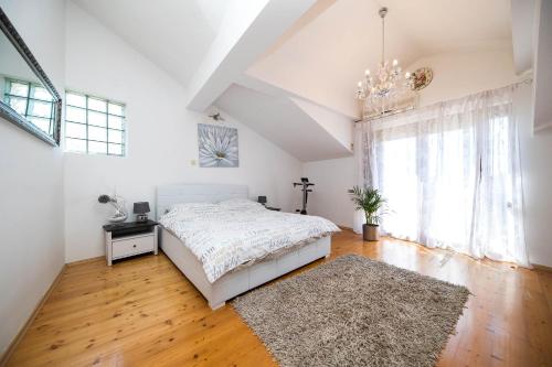 Postel nebo postele na pokoji v ubytování Roko Apartments