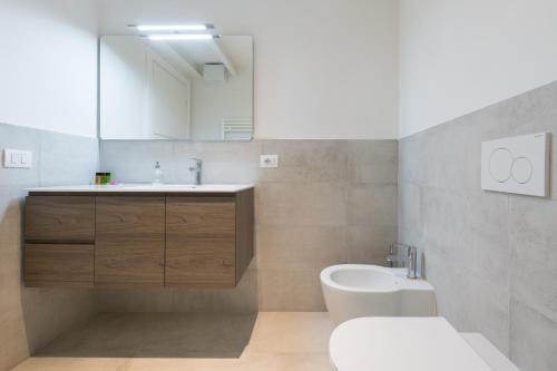 a bathroom with a sink and a toilet at Masai - One bedroom flat 1st floor by train station in Florence