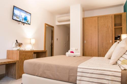 Ένα ή περισσότερα κρεβάτια σε δωμάτιο στο Hotel Maria