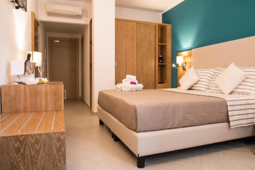 Postel nebo postele na pokoji v ubytování Hotel Maria