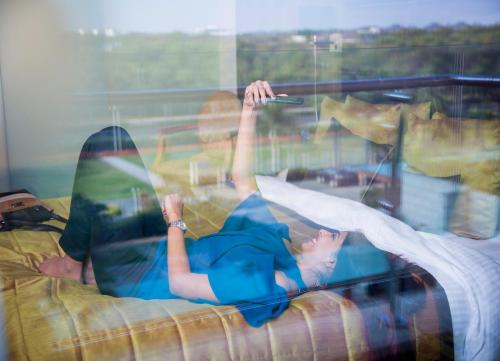 a couple of people laying on a couch at Novotel Hyderabad Airport in Hyderabad