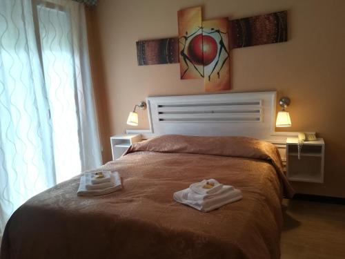 Ένα ή περισσότερα κρεβάτια σε δωμάτιο στο Hotel Eva La Romantica