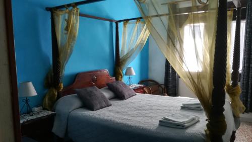 Кровать или кровати в номере Hostal Restaurante La Diligencia