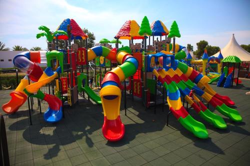 a playground with a brightly colored playground at Devesa Gardens in El Saler