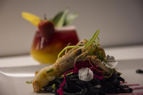 a piece of food on a plate with an apple at Hotel Dal Menga in Torrebelvicino