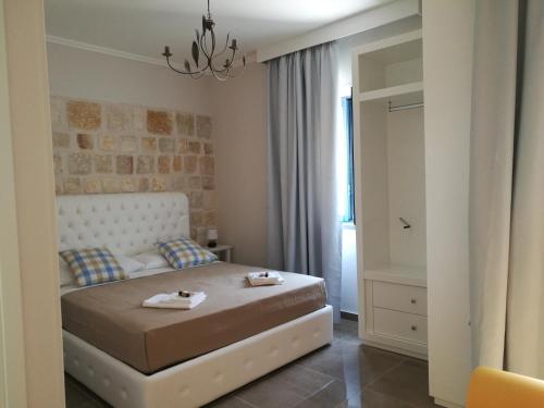 Postel nebo postele na pokoji v ubytování Hotel Residence La Corvetta