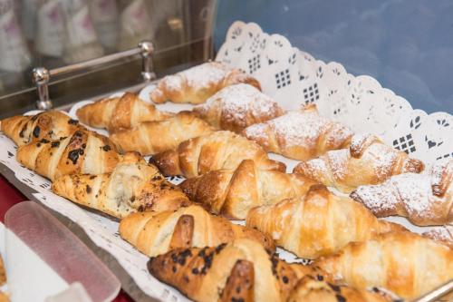 a bunch of pastries sitting on a table at Hotel Primo in Riva del Garda