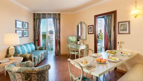a living room with a couch and a table at Residence Carl&Do in Baveno