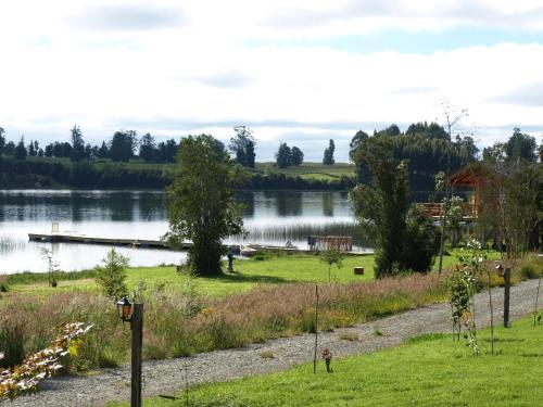 a view of a lake with a dock at CABAÑAS Gracias a la Vida Lodge in Puerto Varas