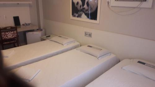 Katil atau katil-katil dalam bilik di Hotel Gramado de Campos