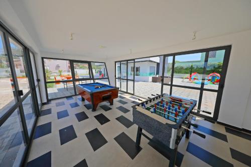 a large room with a pool table and a pool table at Boutique Apartments Blitz in Bibinje