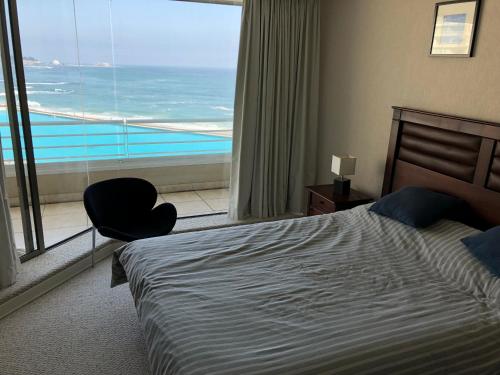 A bed or beds in a room at San Alfonso del Mar 802