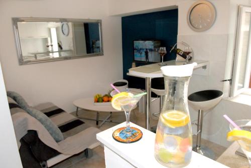 a living room with a vase with lemon slices in it at Apartment Piazzeta De Luxe in Split