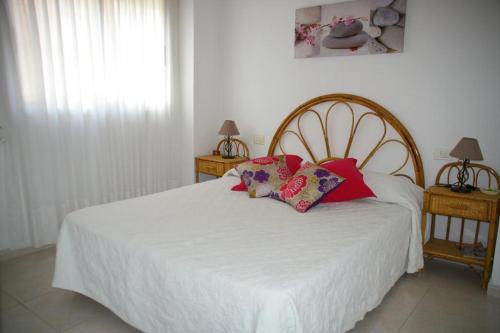 A bed or beds in a room at Villamar Orange Costa