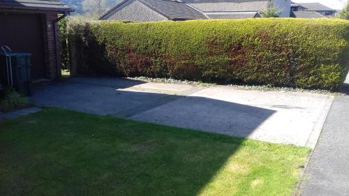 a shadow of a hedge on a driveway at Eagles View in Llanrwst