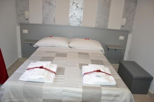 Postel nebo postele na pokoji v ubytování B&B Licata SottoLeStelle