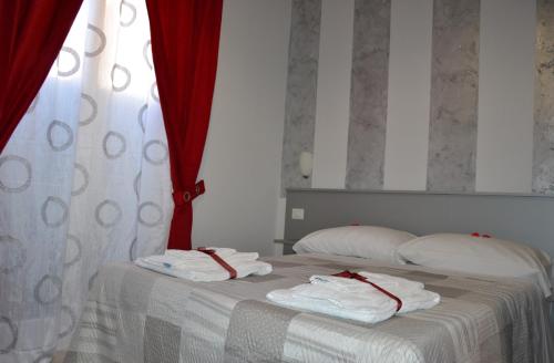 Postel nebo postele na pokoji v ubytování B&B Licata SottoLeStelle