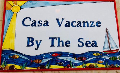 a sign for aaazona by the sea at By the Sea in Terrasini