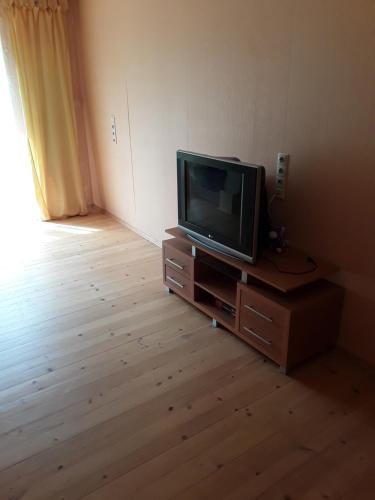 a television sitting on a dresser in a room at Apartment on Danyla Galytskogo 8A in Morshin