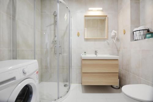 Ένα μπάνιο στο Blue Park Apartament Bliżej Morza Kasprowicza