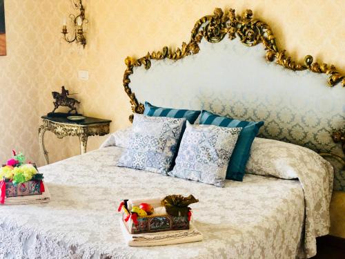 Ένα ή περισσότερα κρεβάτια σε δωμάτιο στο Dimora Umberto