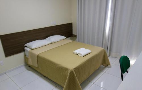 Cama ou camas em um quarto em Velit Hotel