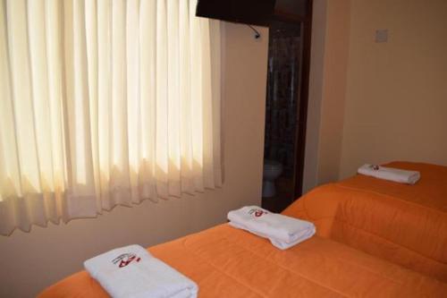 Katil atau katil-katil dalam bilik di Peru Swiss Hostel