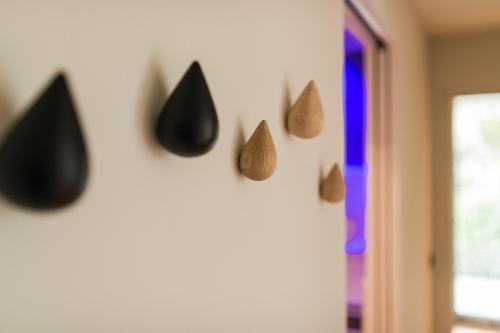 a wall with different types of shapes on it at Hotel Das Dorner in Lagundo