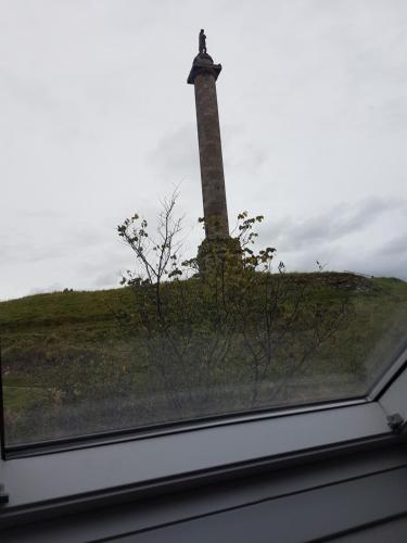 a lighthouse on top of a roof with a window at ladyhill flat in Elgin