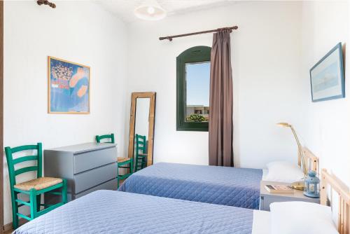 A bed or beds in a room at Traditional Sea Side Cottage