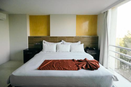 Cama o camas de una habitación en Hotel El Español Paseo de Montejo