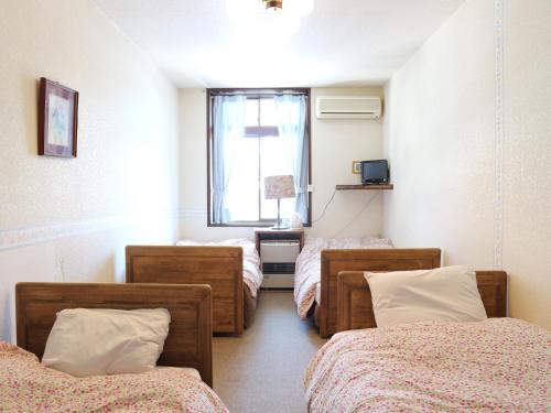 Postel nebo postele na pokoji v ubytování Garden Pension Obergurgl
