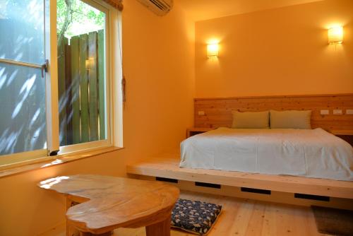 Postel nebo postele na pokoji v ubytování Taiori House