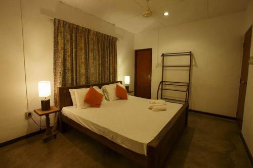 Ein Bett oder Betten in einem Zimmer der Unterkunft Villa Sanasuma