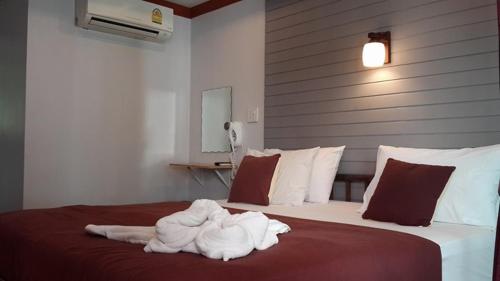 Кровать или кровати в номере Sinsamut Koh Samed