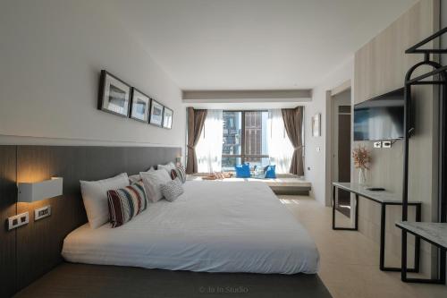 Ένα ή περισσότερα κρεβάτια σε δωμάτιο στο NornDee Hotel